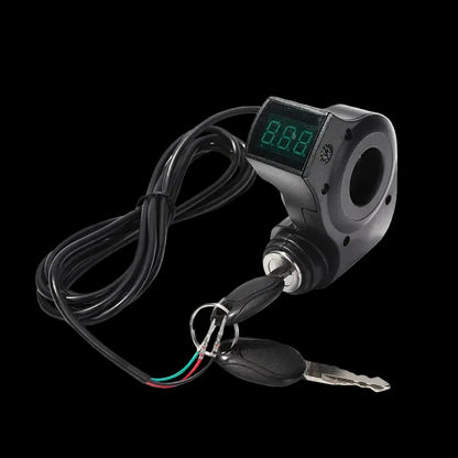 A black electronic motor speed controller with a digital LCD display showing green digits, a key switch, and two keys on a black background.