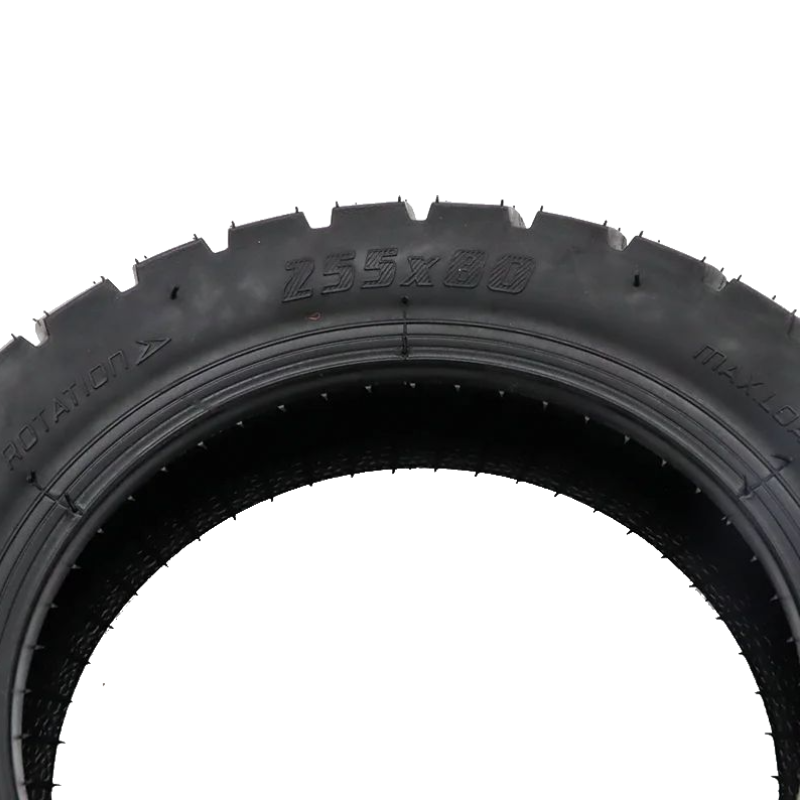A close-up of a black rubber tire sidewall showing embossed text including 'Z55X80' and 'MAX LOAD', photographed against a plain white background.