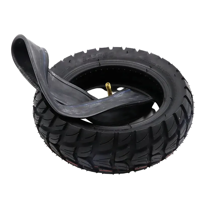 A black rubber e scooter or bicycle tire with a matching inner tube partially peeled back, showing a gold valve stem, photographed on a white background.